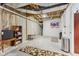Unfinished basement features a dart board, exposed ceiling, concrete walls, and minimal furnishings for storage or hobbies at 11844 Pine Meadow Cir, Fishers, IN 46037