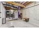 Unfinished basement with exposed ceiling, concrete walls, and minimal furnishings provides a space for storage or activities at 11844 Pine Meadow Cir, Fishers, IN 46037