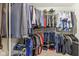 This walk-in closet offers ample storage space with organized hanging racks and shelving at 11844 Pine Meadow Cir, Fishers, IN 46037