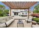 Backyard patio features comfortable seating and dining area with a view of the home at 12437 Meeting House Rd, Carmel, IN 46032