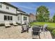 Backyard has lounge chairs, a fire pit and comfortable chairs for outdoor entertaining at 12437 Meeting House Rd, Carmel, IN 46032