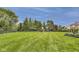 Enjoy this large grassy backyard with a playground and mature trees at 12437 Meeting House Rd, Carmel, IN 46032