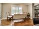 This home features a breakfast nook with wood floors and a large window that provides natural light at 12437 Meeting House Rd, Carmel, IN 46032