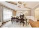 Elegant dining room featuring a coffered ceiling, modern chandelier, and a neutral color palette at 12437 Meeting House Rd, Carmel, IN 46032