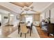 Sophisticated dining room showcasing hardwood floors, a striking chandelier, and an open, airy ambiance at 12437 Meeting House Rd, Carmel, IN 46032