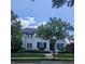 Charming white two-story home with black shutters, mature trees, and manicured landscaping at 12437 Meeting House Rd, Carmel, IN 46032