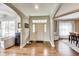 Inviting foyer with hardwood floors, crisp white trim, and a bright entrance with views to adjacent living spaces at 12437 Meeting House Rd, Carmel, IN 46032