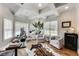 Bright and spacious home office boasts hardwood floors, multiple windows, and a dedicated workspace at 12437 Meeting House Rd, Carmel, IN 46032