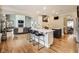 This home features a kitchen with stainless steel appliances, a center island, and bar stool seating at 12437 Meeting House Rd, Carmel, IN 46032