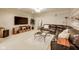 Cozy living room featuring a sectional sofa, media center, and stylish décor at 12437 Meeting House Rd, Carmel, IN 46032