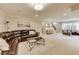 Spacious living room featuring hardwood floors, comfortable seating, and a decorative staircase at 12437 Meeting House Rd, Carmel, IN 46032