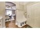 This home features a mud room with a bench and storage with direct access to the front door and dining room at 12437 Meeting House Rd, Carmel, IN 46032