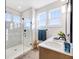 Bright bathroom featuring a glass-enclosed shower, bright white quartz countertop, and modern fixtures at 13406 Vickery Ridge Dr, Fishers, IN 46037