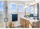 Bathroom featuring a glass-enclosed shower, bright white quartz countertop, and double sink vanity at 13406 Vickery Ridge Dr, Fishers, IN 46037
