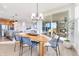 Dining room features a modern table and chairs, a sliding door, and wood-style floors at 13406 Vickery Ridge Dr, Fishers, IN 46037