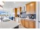 Modern kitchen featuring stainless steel appliances, wood cabinets, and center island at 13406 Vickery Ridge Dr, Fishers, IN 46037