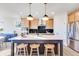 Bright kitchen has stainless steel appliances, modern fixtures, and ample cabinet space at 13406 Vickery Ridge Dr, Fishers, IN 46037