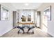 Bright office space features a wooden desk, modern decor, and natural light at 13406 Vickery Ridge Dr, Fishers, IN 46037