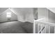 Finished attic space featuring carpeted floors and a window air conditioning unit at 1418 Olive St, Indianapolis, IN 46203