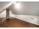 Spacious attic with hardwood floors, neutral paint and a chimney feature at 1418 Olive St, Indianapolis, IN 46203