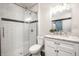 Bathroom featuring subway tile shower, a marble countertop, and modern fixtures at 1418 Olive St, Indianapolis, IN 46203