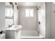 Bathroom featuring a shower/tub combo, a vintage mirror, and subway tiles at 1418 Olive St, Indianapolis, IN 46203