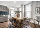 Cozy dining area featuring a wooden table with unique metal chairs, complemented by natural light and stylish decor at 1418 Olive St, Indianapolis, IN 46203