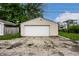 Detached one car garage with cracked driveway at 1418 Olive St, Indianapolis, IN 46203