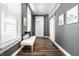Bright hallway with light gray walls, white trim, and a sliding barn door at 1418 Olive St, Indianapolis, IN 46203