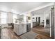 Open kitchen with gray island with seating, stainless appliances, and an open floor plan at 1418 Olive St, Indianapolis, IN 46203