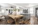 Charming kitchen featuring a central island, stainless steel appliances, and wood flooring at 1418 Olive St, Indianapolis, IN 46203