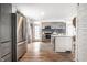 Bright kitchen with gray cabinets, stainless steel appliances, and a striking blue backsplash for modern appeal at 1418 Olive St, Indianapolis, IN 46203