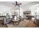Open-concept living room flows into a kitchen featuring a comfortable gray couch and stylish decor at 1418 Olive St, Indianapolis, IN 46203