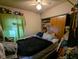 Bedroom featuring a window with a curtain, closet, and an unmade bed at 1433 N Denny St, Indianapolis, IN 46201