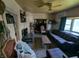 Another angle of the living room with plaid furniture and a view into other room at 1433 N Denny St, Indianapolis, IN 46201