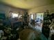 Living room featuring a fireplace, doorway to the bedroom, and shelves at 1433 N Denny St, Indianapolis, IN 46201