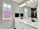 Bathroom boasts double sinks, modern fixtures, and a stylish mirror for a luxurious experience at 158 Handley St, Indianapolis, IN 46222