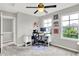 Bright room with a desk and a chair next to some windows and artwork on the wall at 158 Handley St, Indianapolis, IN 46222