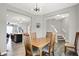 Dining room features a table with chairs, seamlessly connecting the kitchen and living areas for easy entertaining at 158 Handley St, Indianapolis, IN 46222