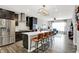 Modern kitchen with stainless steel appliances, island seating, and open floor plan at 158 Handley St, Indianapolis, IN 46222