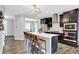 Modern kitchen with stainless steel appliances, island seating, and open floor plan at 158 Handley St, Indianapolis, IN 46222