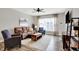 Inviting living room featuring hardwood floors, a large window, and comfortable seating at 158 Handley St, Indianapolis, IN 46222