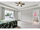 Bright main bedroom includes a large window, tray ceiling, and access to an en-suite bathroom at 158 Handley St, Indianapolis, IN 46222