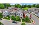 Street view featuring well-kept homes with vibrant exteriors and neatly trimmed trees, enhancing the community's curb appeal at 158 Handley St, Indianapolis, IN 46222