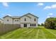 Well-maintained backyard featuring lush green grass and a charming fence, perfect for outdoor enjoyment at 163 Clear Branch Dr, Brownsburg, IN 46112
