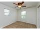 Bright bedroom with neutral carpet, ceiling fan, and two windows offering natural light at 163 Clear Branch Dr, Brownsburg, IN 46112
