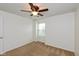 Cozy bedroom with neutral carpet, a ceiling fan, and a window bringing in natural light at 163 Clear Branch Dr, Brownsburg, IN 46112