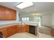 Open concept kitchen with wood cabinets and light countertops, flowing into the living area at 163 Clear Branch Dr, Brownsburg, IN 46112