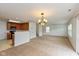 Open-concept living space featuring adjacent kitchen and staircase at 163 Clear Branch Dr, Brownsburg, IN 46112
