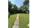Private backyard with green grass and mature trees at 1722 Dawson St, Indianapolis, IN 46203